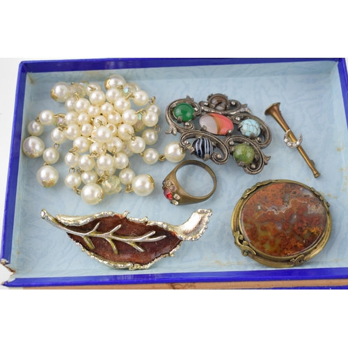 597 - Costume jewellery to include a gold plated mourning locket, a gold plated locket, a crescent moon ba... 