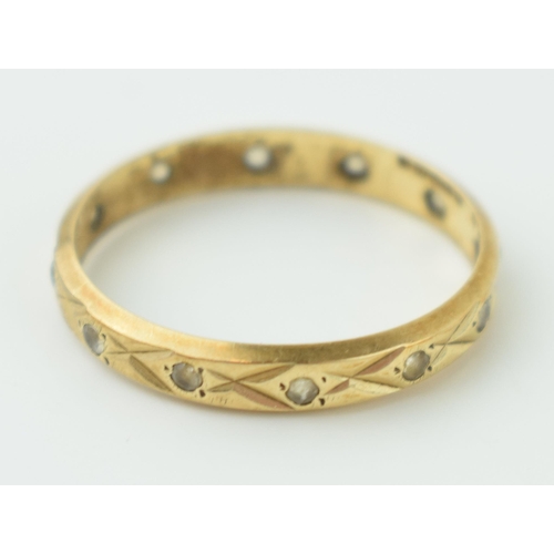 614 - A 9ct yellow gold eternity ring marked .375. Ring size K. Weight 1.1 grams.