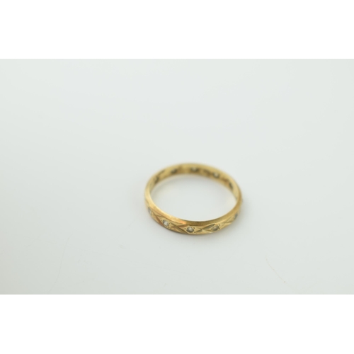 614 - A 9ct yellow gold eternity ring marked .375. Ring size K. Weight 1.1 grams.