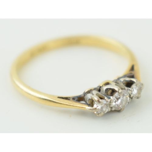 617 - 18ct yellow gold ring, with triple set diamond in platinum mount. Weight 2.0grams.