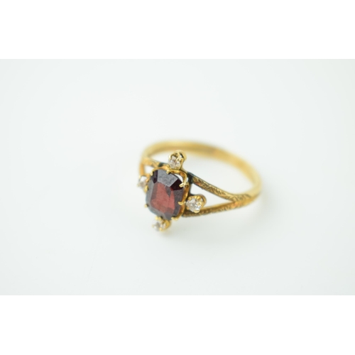 625 - 9ct gold ring, textured shoulders, set garnet and diamonds, tests as 9ct, 3.8g, size R/S.