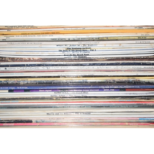 368 - A large collection of vinyl album records including Tammy wynette, Peggy Lee, Dolly Parton etc in th... 