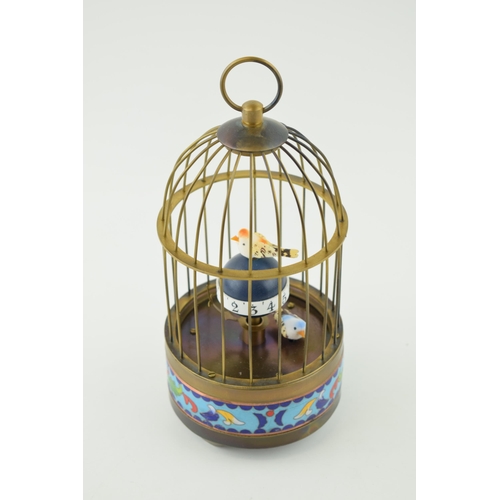 374 - Reproduction brass coloured bird cage clock, cloisonne decoration, working order, 19.5cm tall.