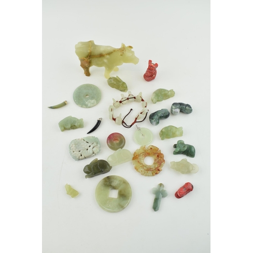 375 - A collection of Jadeite, Jade and similar hard stone carved items to include Bi discs, animals and j... 