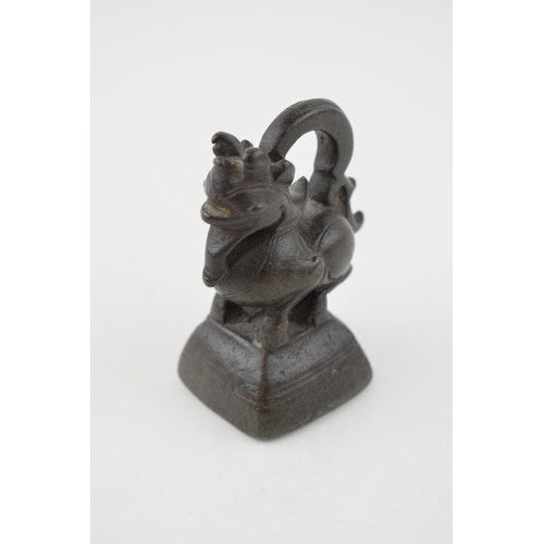 377 - An opium weight, in the form of a dragon, believed Burmese bronze, 7cm tall.