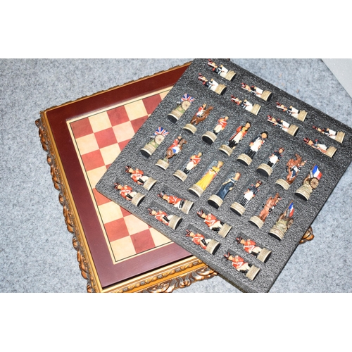 379 - A Modern Ornate Chess Set and Board the chess pieces depicting Napoleonic soldiers in original box