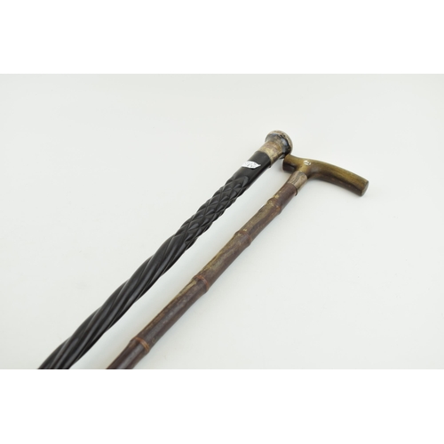 382 - A silver topped ebonised cane, C&Co London together with a bamboo cane with horn handle and silver a... 