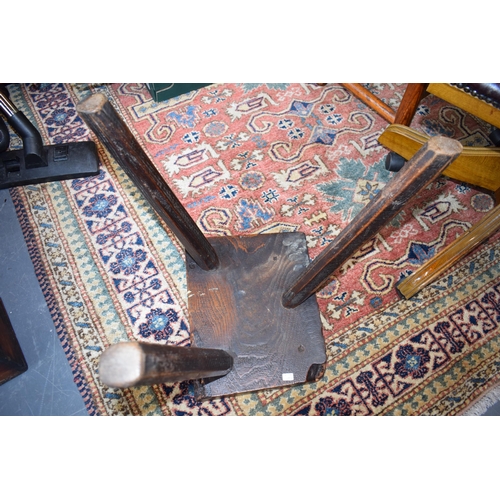 384 - Late 18th / early 19th century three legged country stool, made from elm / ash, showing signs of cha... 