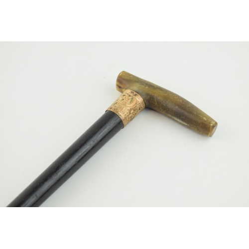 387 - Edwardian ebonised walking stick, gold plated collar, horn handle, 89.5cm long.