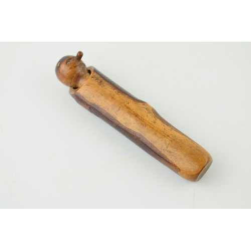 397 - Treen novelty cheroot holder, with carved face, in wooden sleeve, 9cm long.