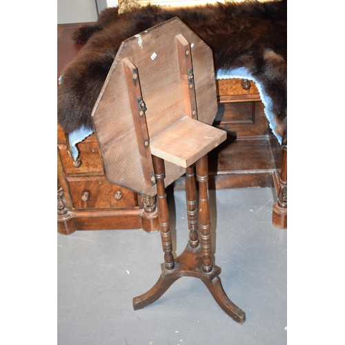 404 - 1930s mahogany tilt-top pedestal table, 74cm tall, 51cm wide.