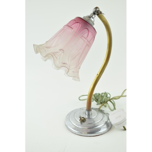 407 - An Art Deco side lamp on chrome circular base with brass arm and adjustable glass shade. Height 32cm... 