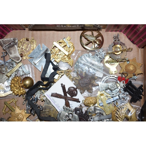 435 - A large collection of military cap badges, mostly WWI and WWII era mainly British and German. (Qty)