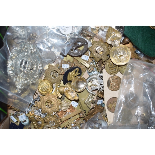 436 - A large collection of military cap badges, WWI and WWII era mainly British, United States and German... 