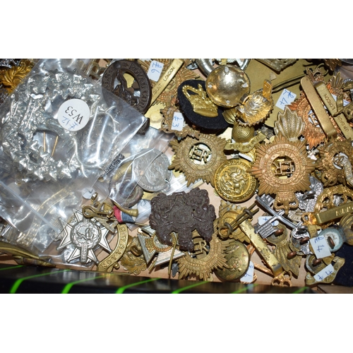 436 - A large collection of military cap badges, WWI and WWII era mainly British, United States and German... 