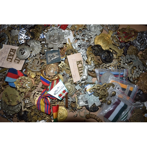 440 - A large collection of military cap badges, ribbons and similar items, WWI and WWII era mainly Britis... 