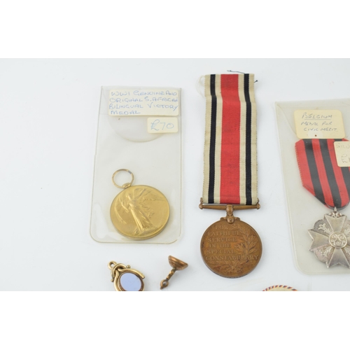 449 - A collection of medals to include WWI Victory Medal, silver Belgium Medal for Civic Merit, Special C... 