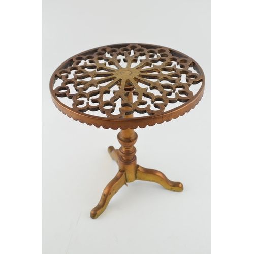 462 - Antique brass fireside trivet, similar to a tripod table, heavy, 27cm tall.