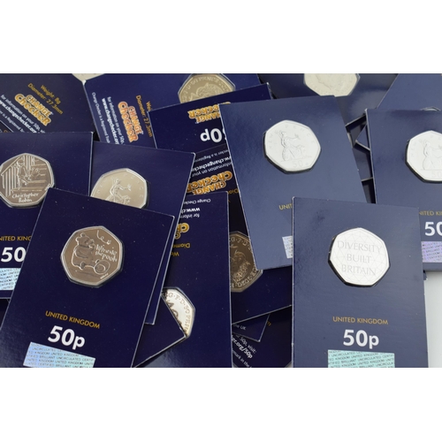 493 - A collection of over 30 carded Change Checker 50p coins, circa 33, with a Royal Mint Carded The Snow... 