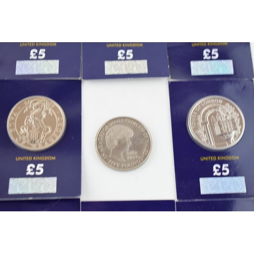 494 - A collection of carded Change Checker £5 coins to include British Red Cross, Vale of Beaufort and ot... 