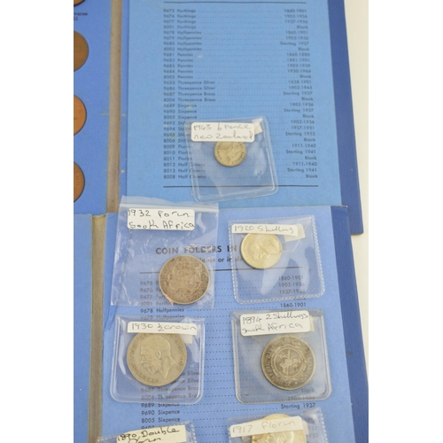 504 - A collection of silver coins to include an 1890 silver double florin, a 1917 florin and others with ... 