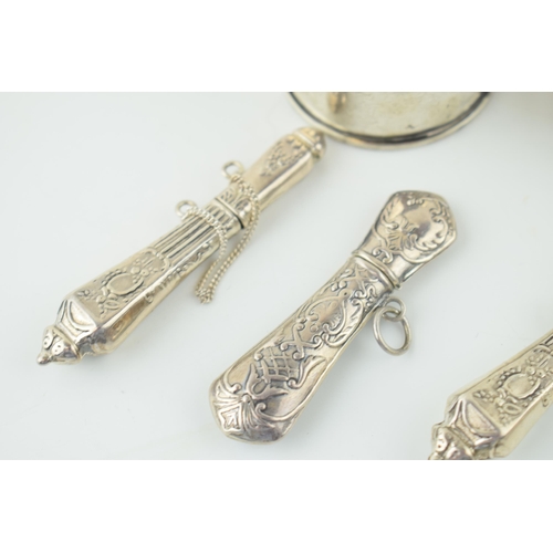 519 - Silver to include five ornate needle cases with a pill box and a napkin ring, combined 82.2g.