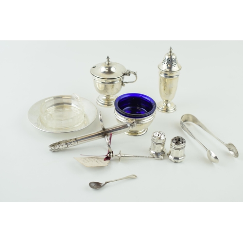 526 - Hallmarked silver to include a pair of tongs, condiments and a dish with glass liner, silver weight ... 