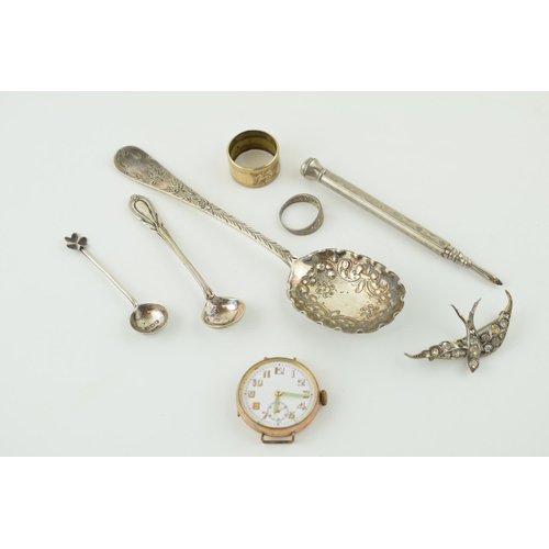 542 - A mixed collection of items to include hallmarked silver spoons, (weight 32 grams) a silver bird bro... 