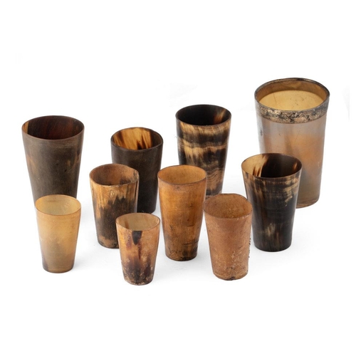 19 - A collection of horn beakers and drinking vessels, Georgian and later, one with white metal rim, ass... 