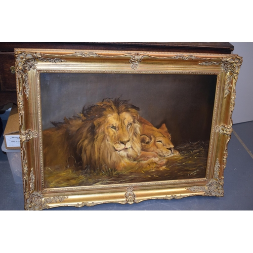 117 - J. Mackereth, after Landseer, 1911. Oil on canvas of Lion and Lioness in gilt frame.  60cm x 90cm