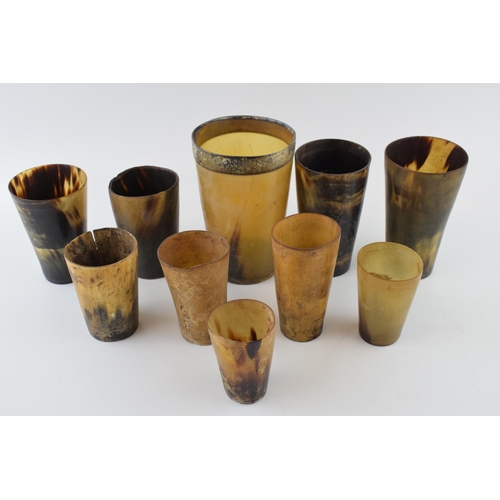 19 - A collection of horn beakers and drinking vessels, Georgian and later, one with white metal rim, ass... 