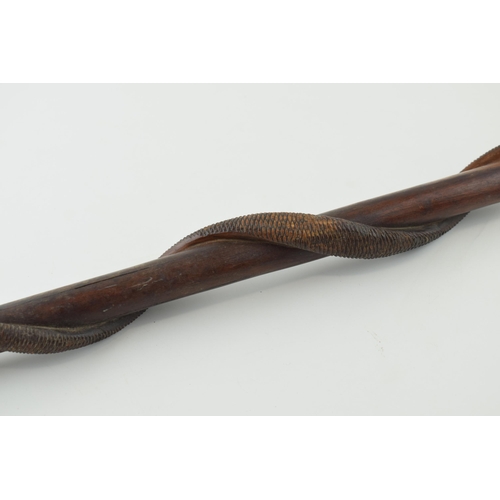 20 - Early to mid 20th century carved wooden walking stick, coiled snake, textured skin, with textured ha... 