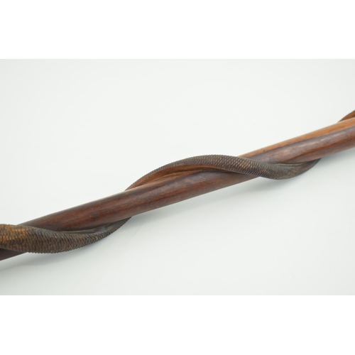 20 - Early to mid 20th century carved wooden walking stick, coiled snake, textured skin, with textured ha... 