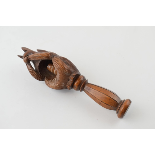 21 - 19th century fruitwood screw-action novelty nut cracker in the form of a squirrel, 17cm tall.