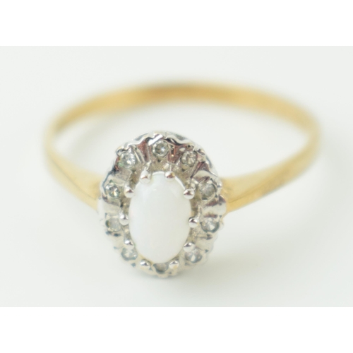 383 - 9ct yellow gold ring set with opal and diamonds. Ring size P. Weight 2g.