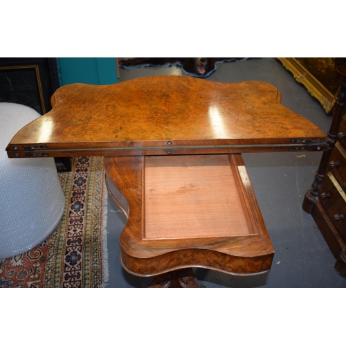 41 - Victorian burr walnut folding card table, ornate base, on four casters, felt top to interior, shaped... 