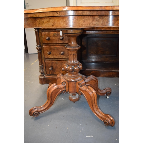 41 - Victorian burr walnut folding card table, ornate base, on four casters, felt top to interior, shaped... 