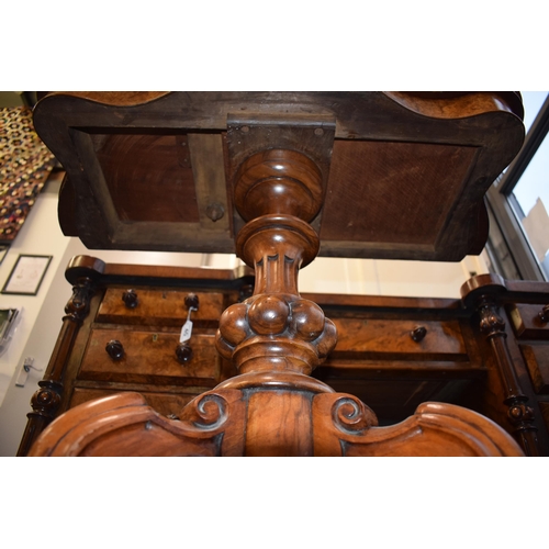 41 - Victorian burr walnut folding card table, ornate base, on four casters, felt top to interior, shaped... 