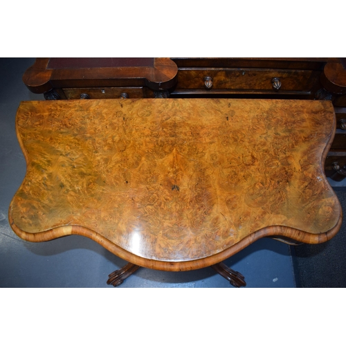 41 - Victorian burr walnut folding card table, ornate base, on four casters, felt top to interior, shaped... 