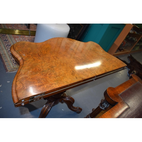 41 - Victorian burr walnut folding card table, ornate base, on four casters, felt top to interior, shaped... 