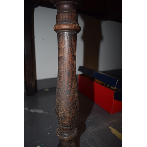 42 - Late 18th / early 19th century oak dresser base, three drawers, turned legs, brass handles and escut... 