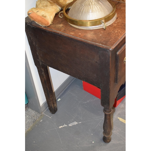 42 - Late 18th / early 19th century oak dresser base, three drawers, turned legs, brass handles and escut... 