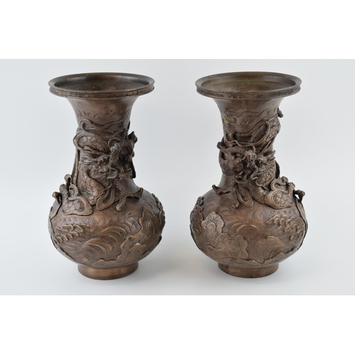 50 - A pair of Chinese bronze vases, with dragon casting, ornate, 20th century made in an 18th century st... 