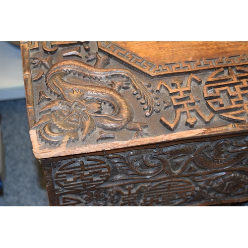 51 - Antique Chinese carved altar table, folding legs with carved figural decoration with character marks... 