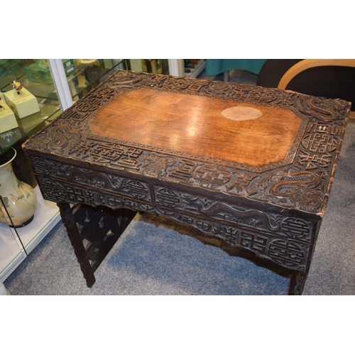 51 - Antique Chinese carved altar table, folding legs with carved figural decoration with character marks... 