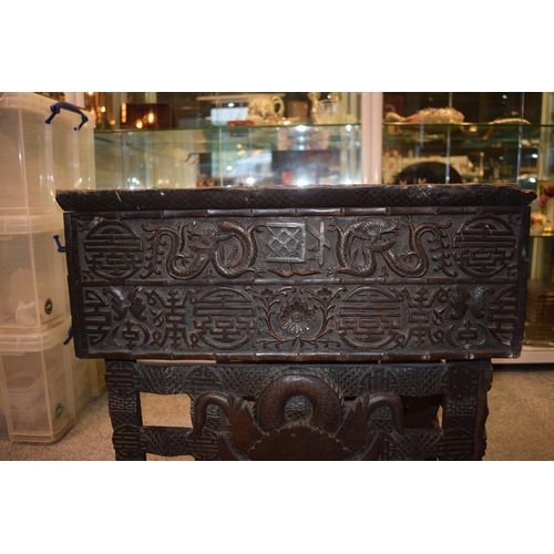 51 - Antique Chinese carved altar table, folding legs with carved figural decoration with character marks... 