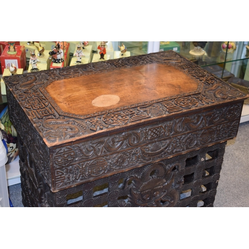 51 - Antique Chinese carved altar table, folding legs with carved figural decoration with character marks... 