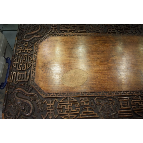 51 - Antique Chinese carved altar table, folding legs with carved figural decoration with character marks... 