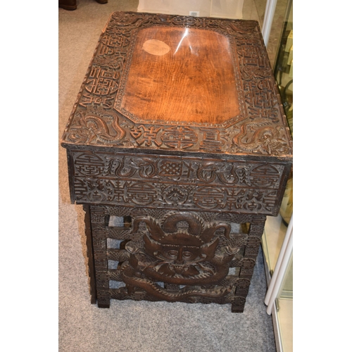 51 - Antique Chinese carved altar table, folding legs with carved figural decoration with character marks... 