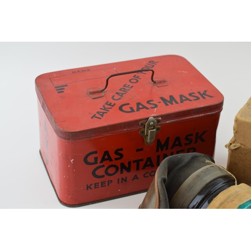 68 - A scarce vintage WW2 red ARP gas mask tin by Elkes Biscuits with original named civilian gas mask in... 